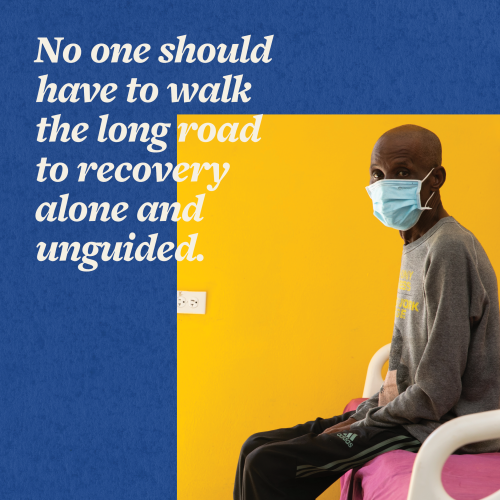 An older Haitian man sits on a bed in the ifectiou disease center, overlaid with the words "no one should have to walk the long road to recovery alone and unguided." 