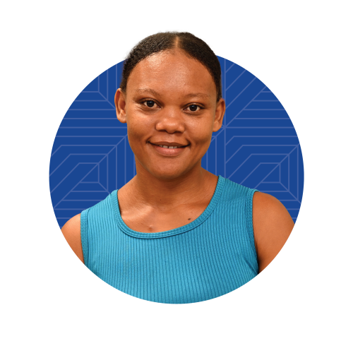 A Haitian woman in a light blue tank top on a circular background with a geometric pattern.