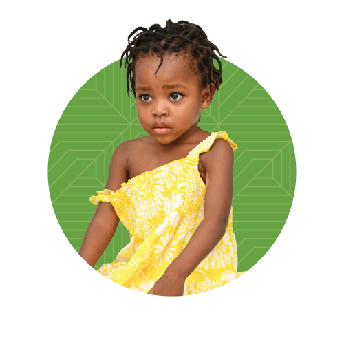 A young Haitian girl in a yellow floral dress superimposed over a green circle with a geometric design on it.