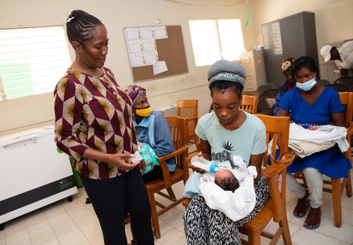 Dr. Miliane Clermont works with a mother and her new baby in SBH's community health room.