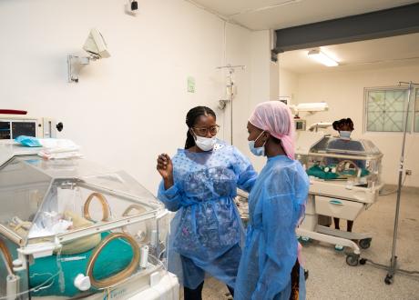 A Haitian clinician speaks to a mother whose baby is in the NICU.