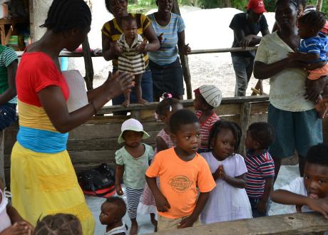 Mother leading group of young children in a song