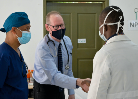 Dr. Farmer greets clinicians at St. Boniface Hospital after the August 2021 earthquake.