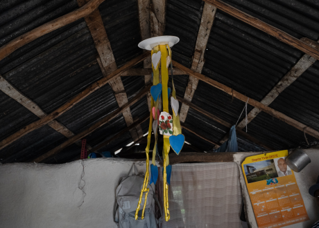 A decoration hangs from the ceiling of Marie's home.