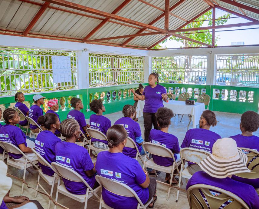 A Kore Sante employee speaks to a group of women for International Women's Day in 2024. 