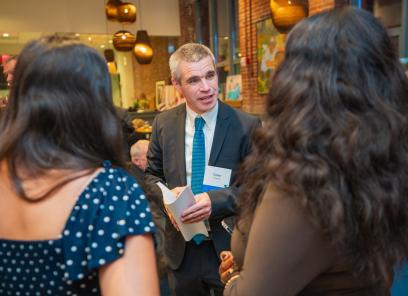 HEI President and CEO Conor Shapiro talks with guests at the organization's 2025 Celebration.