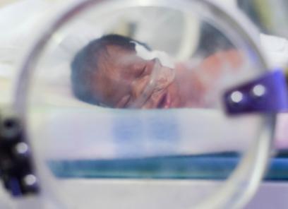 Baby laying in incubator