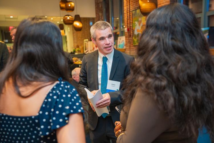 HEI President and CEO Conor Shapiro talks with guests at the organization's 2025 Celebration.