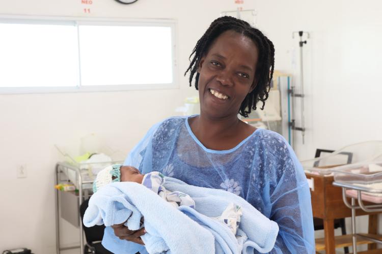 A Haitian mother holds her baby boy in St. Boniface Hospital's NICU.