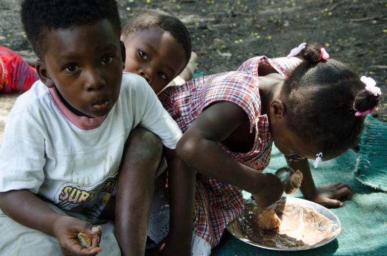 3 young children eating