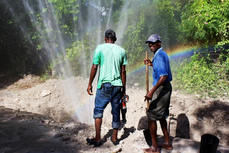 Workers checking a waterline break