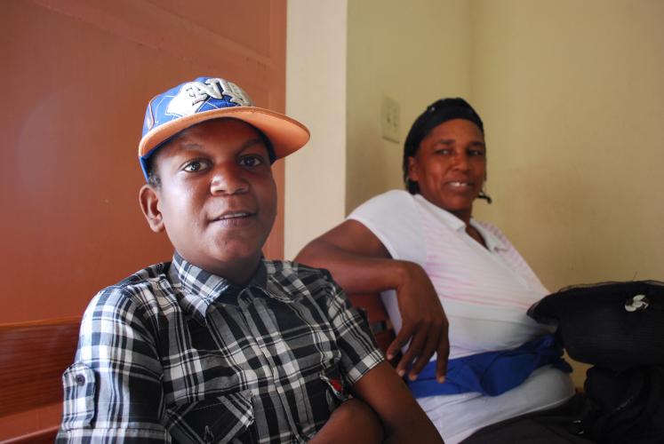 Calebe Terlo and his mother wait at the Villa Clinic