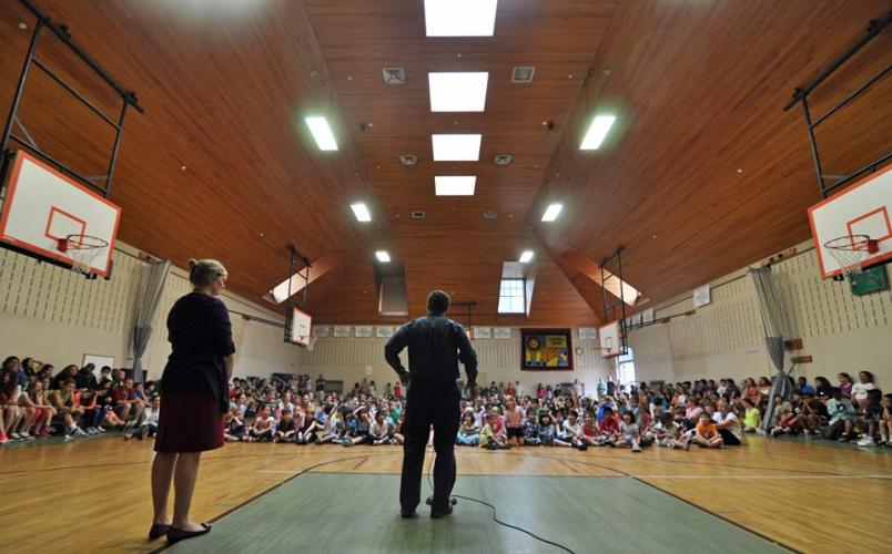 Conor talking at a school assembly at the Lincoln School