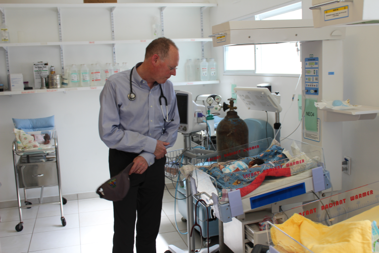 Dr. Paul Farmer looks in on a young patient in our neonatal intensive care unit.