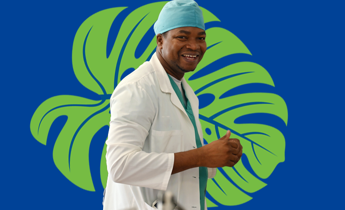 A Haitian male doctor smiling in front of an illustrated green tropical leaf on a dark blue background.