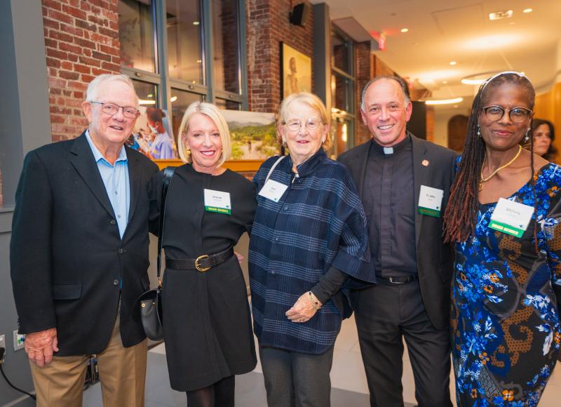 HEI Board Members Sharon McNally, John Unni, and Michele David pose with friends at HEI's 2025 Celebration.