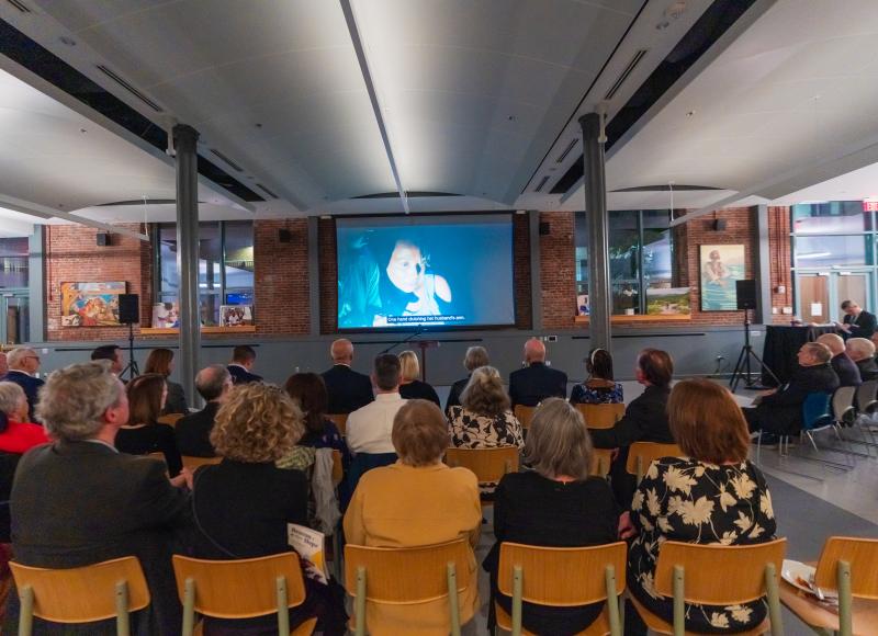 Guests at HEI's 2025 Celebration watch a video about St. Boniface Hospital..