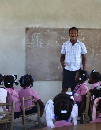 Teacher standing in front of a classroom of students