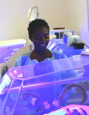 Jessica Cadet with her baby in the NICU