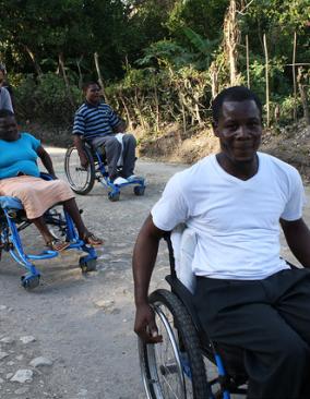 Two men in wheelchairs